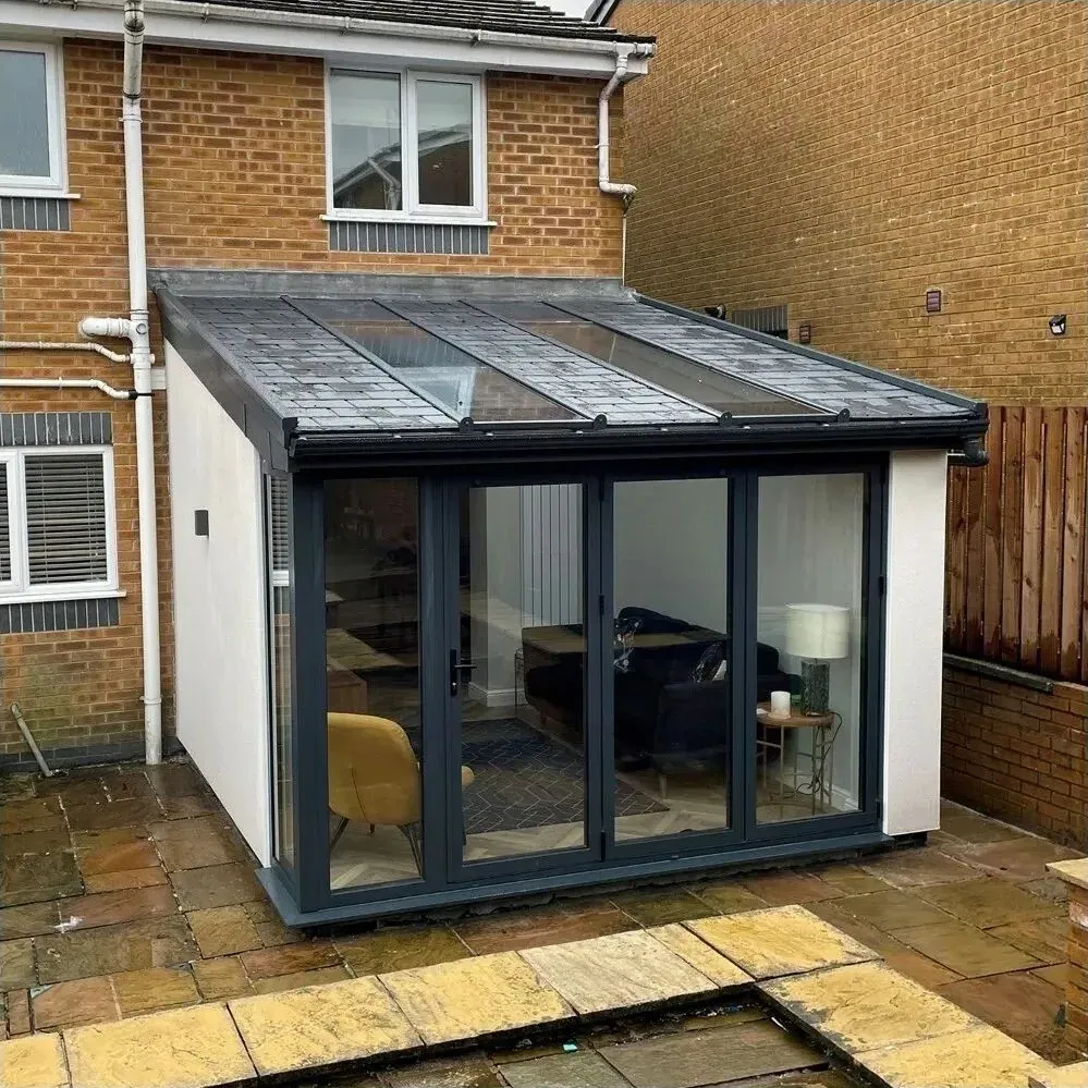 Modular extension with a new solid insulated roof and anthracite sliding doors